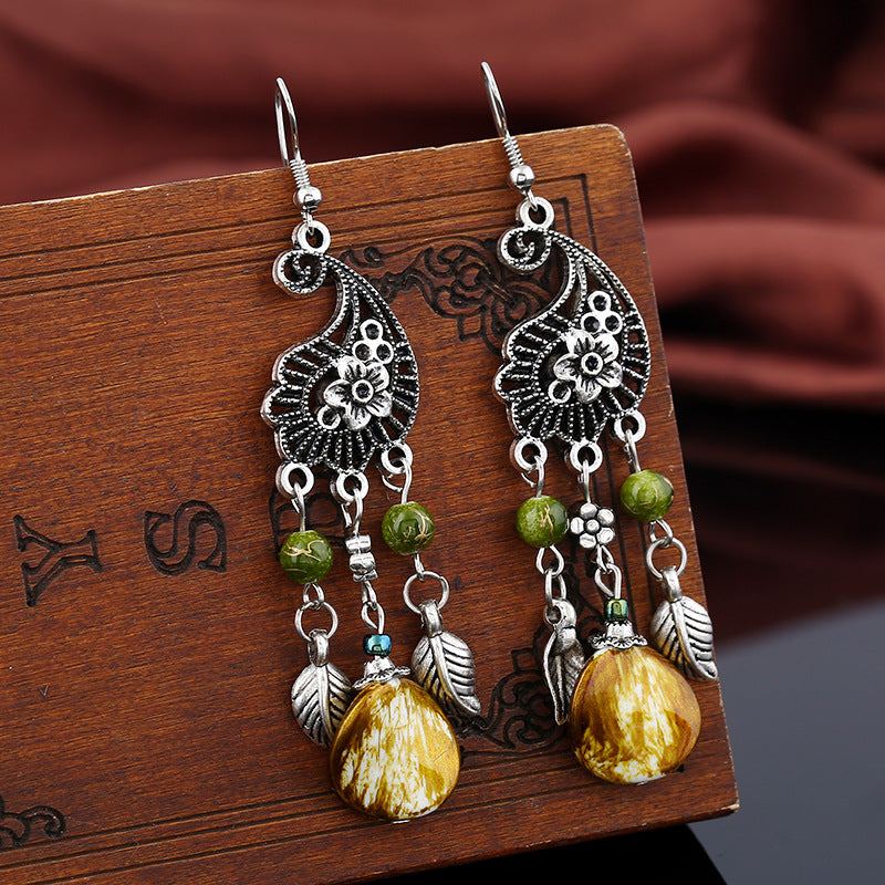 Wholesale retro hollow carved leaves tassel earrings